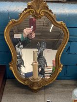 A antique gilt framed mirror and candle holder, shipping unavailable