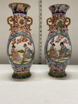 A pair of Chinese fine porcelain hand painted vases singed to the base h27cm