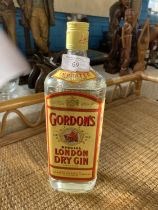 A sealed vintage bottle of Gordon's Gin 1 litre