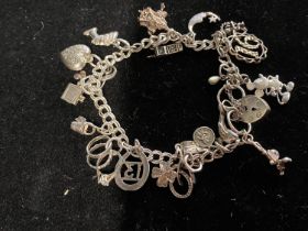 A 925 silver charm bracelet 20.06g