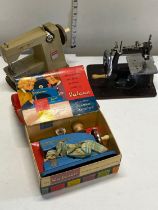 Three vintage children's sewing machines