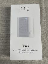 A boxed and sealed Ring plug in door chime (untested)