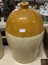 A large heavy salt glazed earthenware wine flagon R and W Wright of Macclesfield h55cm, shipping