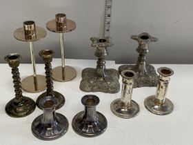 A selection of silver plated candlesticks