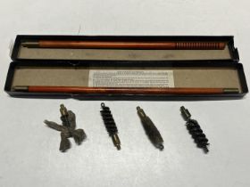 A boxed vintage gun cleaning kit