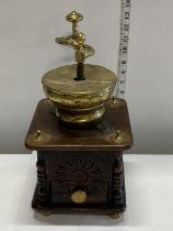 A antique wooden and brass coffee grinder