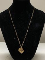 A 9ct gold necklace and pendants 9.68g