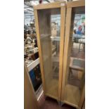 A wooden and glazed display cabinet 189x46x40cm, shipping unavailable