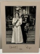 A signed photograph of Queen Elizabeth II and Prince Philip. A personal gift from HM, presented to
