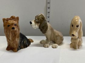 Two Slyvac ceramic dog figurines and one other