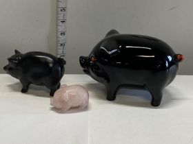 Two ceramic pig money boxes and a pink hardstone pig