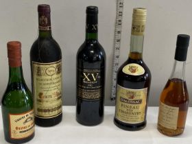 Five assorted bottles of sealed vintage alcohol including champagne cognac, brandy & wine etc