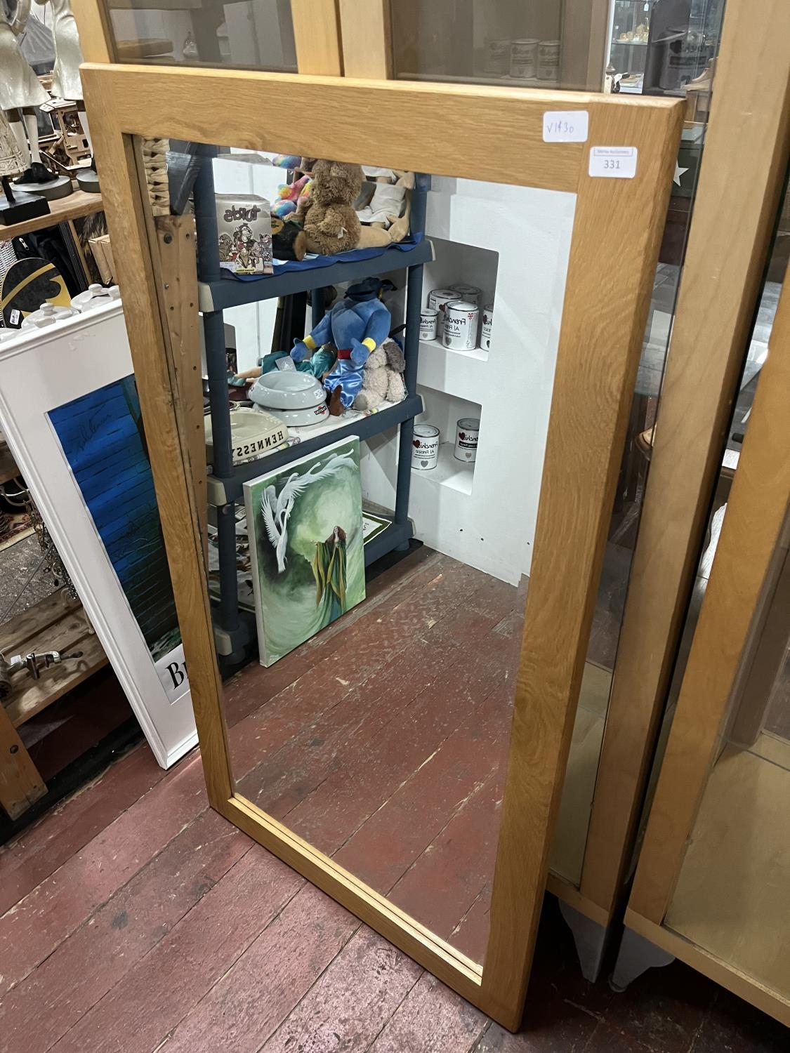 A large contemporary oak framed mirror with bevelled edge glass 135x74cm, shipping unavailable