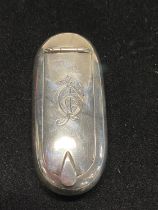 A hallmarked for London 1898 snuff box with monogram to lid and coat of arms to reverse (possibly