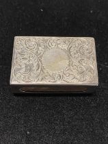 A hallmarked for Birmingham 1900 silver matchbox holder with blank cartouche, maker Spurrier & Co,