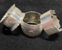 Three assorted hallmarked silver napkin rings, total weight 70g