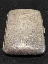 A hallmarked for Chester 1898 silver cigarette case by William Neale with inscription to interior '