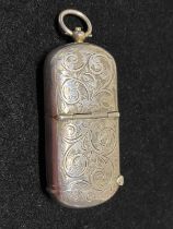 A hallmarked for Birmingham 1906 silver vesta and sovereign holder with monogram to cartouche, maker