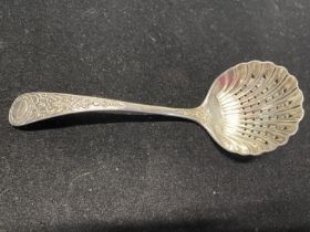A hallmarked for Sheffield 1894 silver straining spoon with intricate decoration, maker Joesph