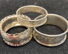 Three assorted hallmarked silver napkin rings, total weight 51g