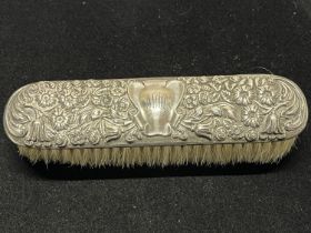 A hallmarked for Chester 1906 silver topped hairbrush by Ridley Hayes?