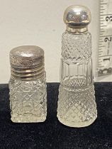 Two hallmarked silver topped bottles one with glass stopper