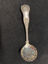 A hallmarked for London 1872 silver straining spoon by Harold Child?, 53g