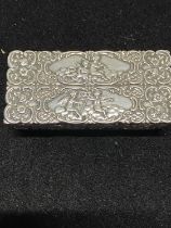 A hallmarked for Birmingham 1894 silver snuff box finely decorated with cherubs and foliage, a