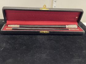 A stunning hallmarked for London 1904 silver mounted and ebony conductors baton in original case.