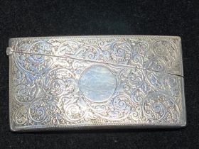 A hallmarked for Birmingham 1901 silver card case with blank cartouche, finely engraved, by Deakin