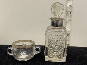 A hallmarked silver collared scent bottle and a hallmarked silver two handled cup