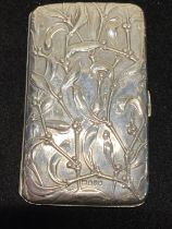 A hallmarked for London 1902 silver cigarette case finely decorated with foliage and gilt