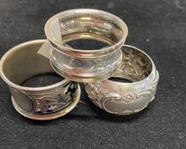 Three assorted hallmarked silver napkin rings, total weight 73g