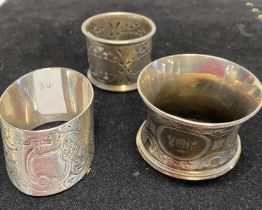 Three assorted hallmarked silver napkin rings, total weight 92g