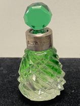 A hallmarked for Birmingham 1894 silver collared green and clear glass perfume bottle by Sydney & Co
