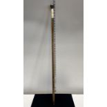 A hallmarked for London 1892 walking cane with dedication to top and bone handle, shipping