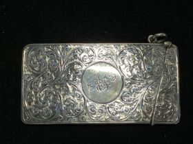 A hallmarked for Chester 1913 silver card case with monogram on cartouche, finely engraved, maker