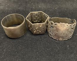 Three assorted hallmarked silver napkin rings, total weight 84g