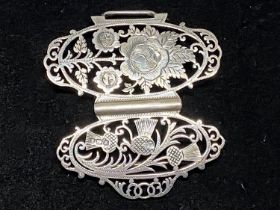 A hallmarked for Sheffield 1899 silver buckle with thistle and flower decoration, maker Joesph