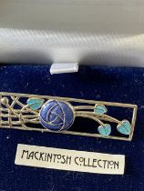 A silver Mackintosh collection brooch