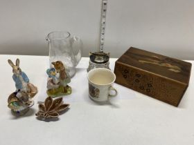 A selection of assorted collectables including Royal Doulton, Beatrix Potter and a Japanese wooden