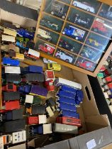 A box of assorted die-cast models