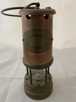 A vintage British Coal Mining Company miners lamp