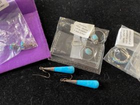 A selection of silver earrings