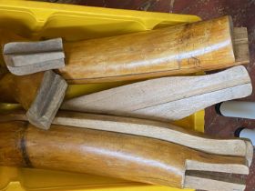 A box of treen boot stretchers