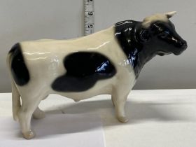 A large ceramic bull figurine possibly Melba