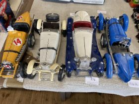 Four assorted Burago car models a/f