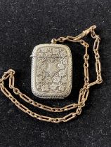 A white metal vesta case and gold tone chain. Chain length 40cm overall.