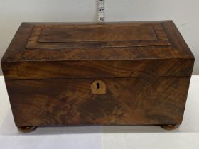 A good quality large walnut stationery box on bun feet