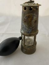 A miniature miners lamp and pressure balloon